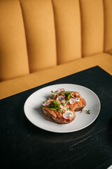 Healthy Seafood Sandwich with crab and radish vegetables  on white plate in diner restaurant furniture