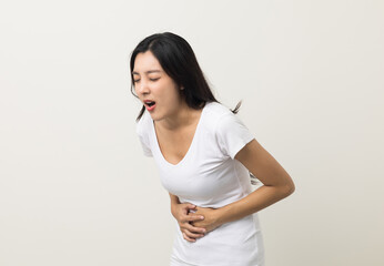 A woman had a stomach ache and gastritis. She put her hand on her stomach and squeezed it to relax...