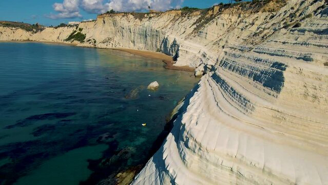 Scala dei Turchi,Sicily,Italy.Aerial view of white rocky cliffs, turquoise clear water.Sicilian seaside tourism, popular tourist attraction.Limestone rock formation on the coast.Travel holiday scenery