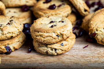 delicious dried cookies made of high-quality flour with dried red cranberries on the table