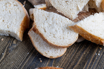 sliced loaf of bread on a cutting wooden board