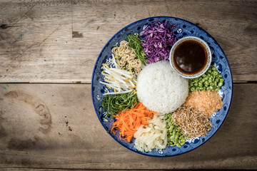 Khao Yam Pak Tai or Spicy Rice Salad is the traditional southern region of Thai food.