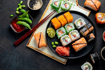 Sushi assortment on dark background.