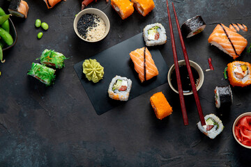 Sushi assortment on dark background.