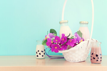 Photo of dairy products over wooden table. Symbols of jewish holiday - Shavuot