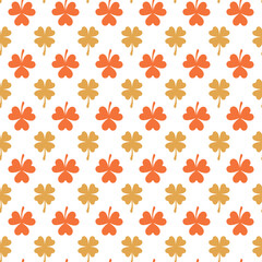 White seamless pattern with orange and yellow clover.