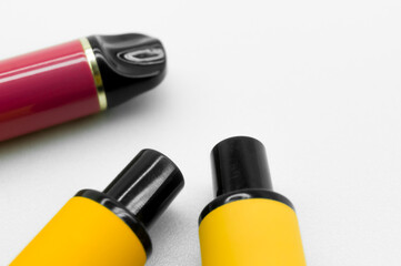 Modern electronic cigarettes on a white background. Fashionable smoking device. E-cigarette for...