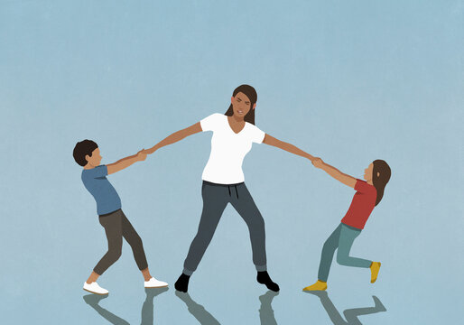 Daughter and son pulling arms of frustrated, overwhelmed mother
