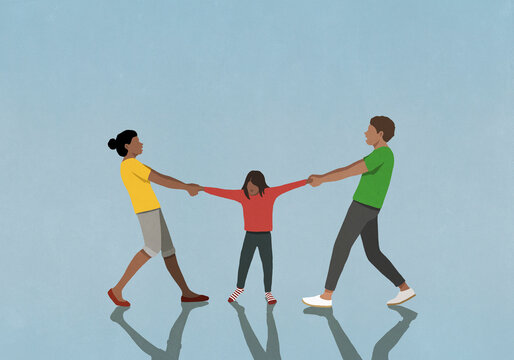 Divorcing father and mother pulling arms of daughter
