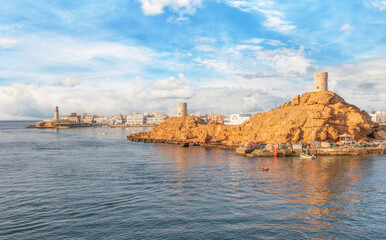 Sur, Oman - an important point for sailors and famous also for its building wooden ships, Sur is a pearl of Oman, with its fusion of green waters, white buildings and red rocks