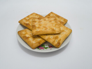 Flat dry toast made from savory wheat sprinkled with sugar is called cracker biscuit