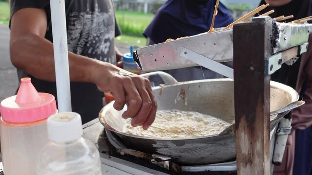Cilor is a typical Indonesian street food made from starch, fried on a bamboo skewer and seasoned with spices