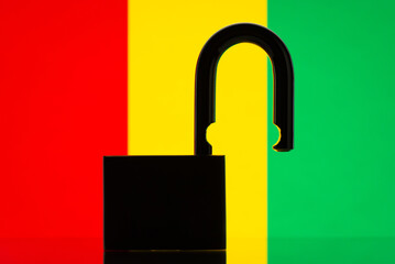 Silhouette of open lock on background of flag of Guinea. Open borders of the country, easy to enter the country concept