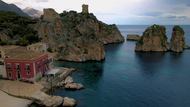 Picturesque summer view of Tonnara di Scopello. Beautiful landscape of Sicily, Italy, and Europe. Calm morning seascape of the Mediterranean sea