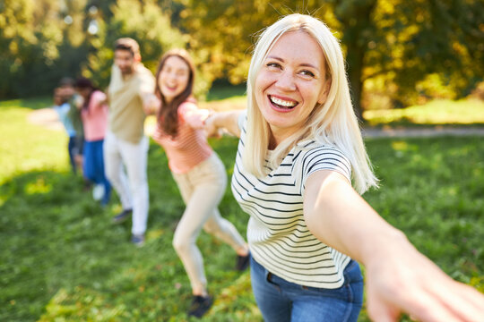 Young woman and friends in team building workshop
