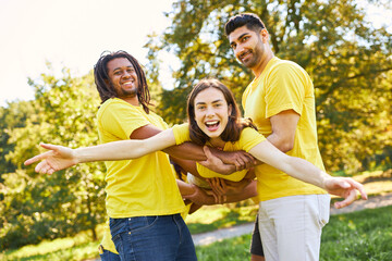 Group of people lifts woman at team building exercise