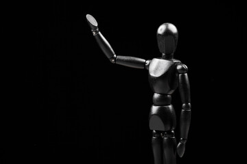 image of wooden mannequin dark background 