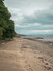 View across the Firth of forth, Edinburgh, Scotland. The tide is out and the famous forth rail...