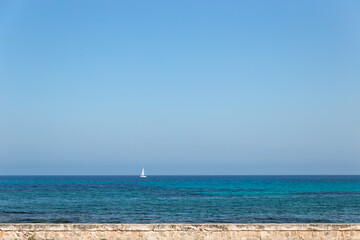 Obraz na płótnie Canvas boat on the water with wall at coast of sa coma mallorca