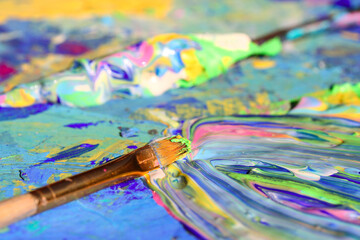 Closeup of brush and art painting