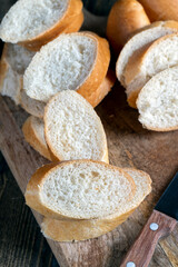 wheat baguette cut into pieces on a cutting board