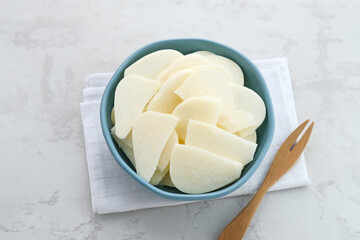 A bowl of fresh jicama or bengkoang (Jicama slices), gut health.
