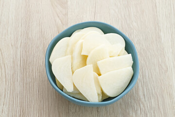 A bowl of fresh jicama or bengkoang (Jicama slices), gut health.
