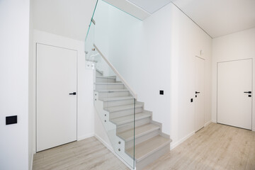 The wooden staircase in duplex apartment