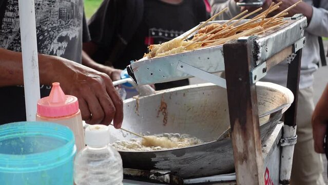 Cilor is a typical Indonesian street food made from starch, fried on a bamboo skewer and seasoned with spices
