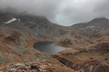 Lake in the mountains on a clouded day.