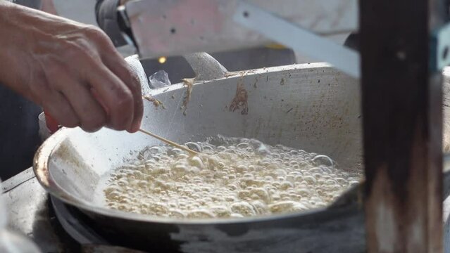 Cilor is a typical Indonesian street food made from starch, fried on a bamboo skewer and seasoned with spices