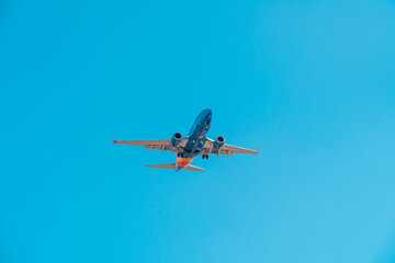Airliner in blue sky. Travel, air transportation concept