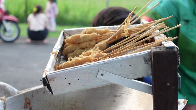 Cilor is a typical Indonesian street food made from starch, fried on a bamboo skewer and seasoned with spices