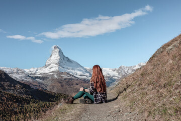 Woman staring at the beautiful Matterhorn glacier in Zermatt, Switzerland.