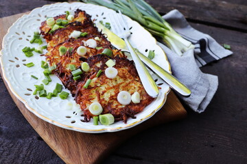 Fried potato pancakes on the old wooden background