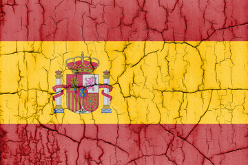 Textured photo of the flag of Spain with cracks.