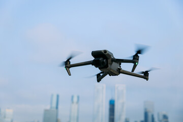 Flying drone in modern city
