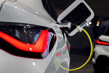 Obraz na płótnie Canvas Charging for an electric car. Modern technologies.