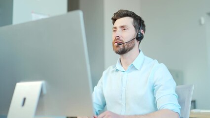 Corporate operator working in customer support service on helpline telesales. Focused man representative call center agent in wireless headset helping client with complaints using computer in office - Powered by Adobe