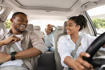 Happy African American Family Riding New Automobile Singing Having Fun