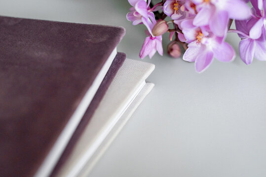 album-book with heavy pages in pink and white cloth cover