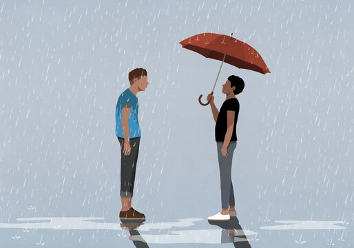 Man under umbrella face to face with man standing in rain
