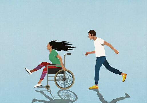 Man chasing carefree woman speeding in wheelchair
