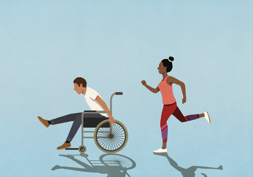 Wife running, chasing happy husband in wheelchair
