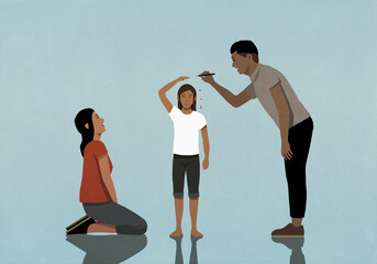 Happy parents measuring and marking height of growing daughter
