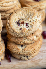delicious dried cookies made of high-quality flour with dried red cranberries on the table