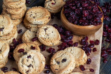delicious dried cookies made of high-quality flour with dried red cranberries on the table