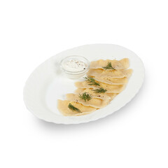 Dumplings with sour cream on a white plate isolated