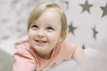 Cute toddler girl brushing teeth in the bathroom. Teeth cleaning, dental care.