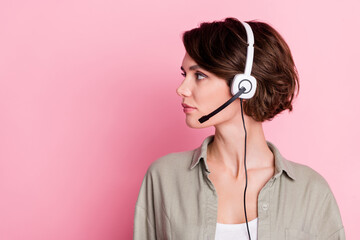 Profile photo of pretty operator lady look empty space wear khaki shirt isolated on pink color...